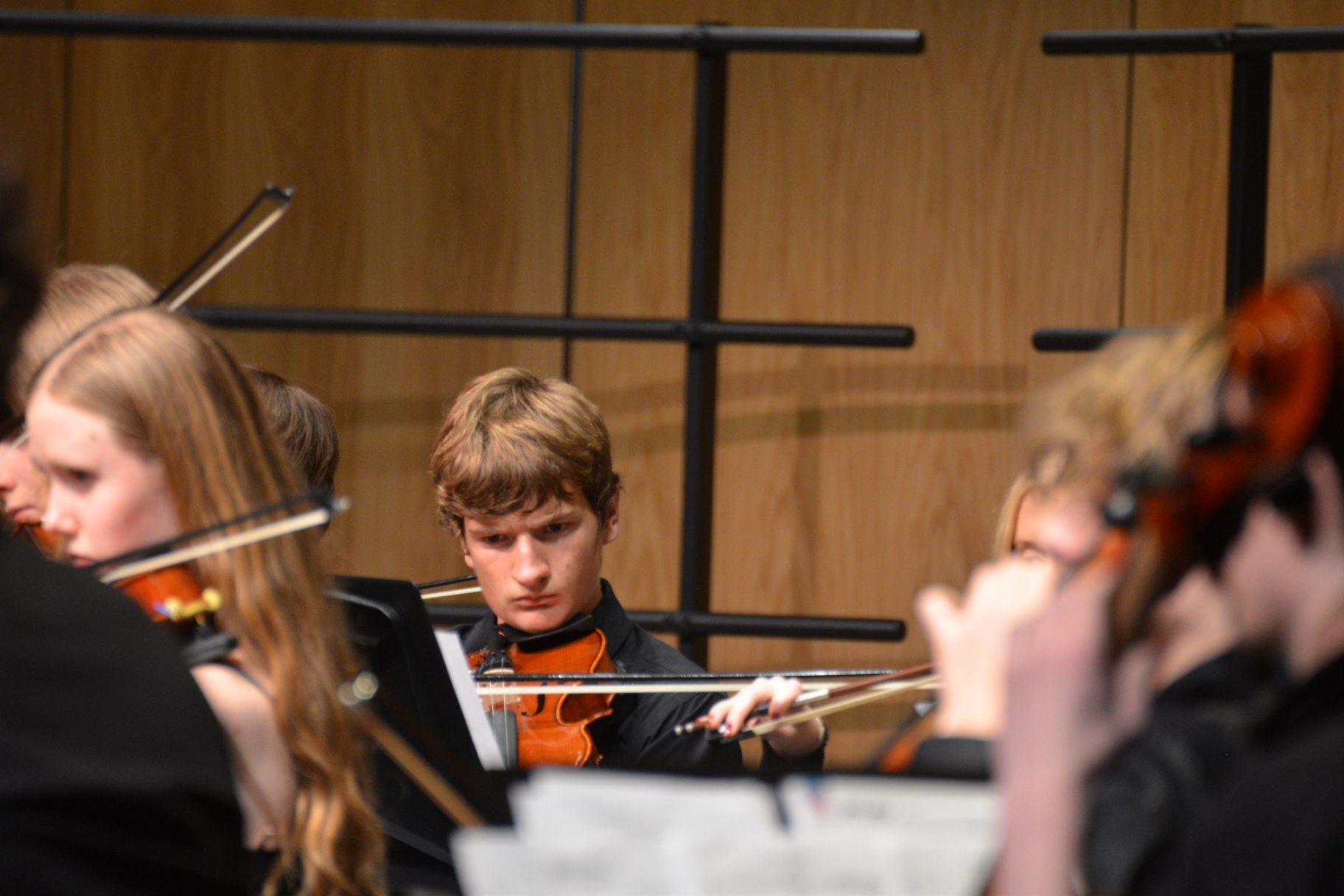 Violinist concentrating during an orchestra performance